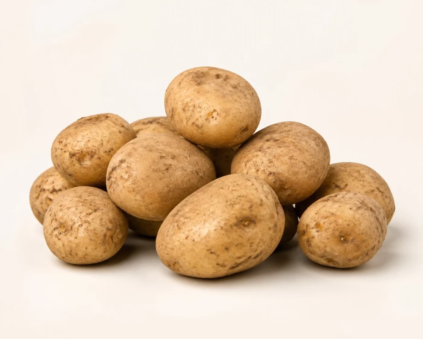 Fresh Pahadi Potato arranged on a warm off-white surface.